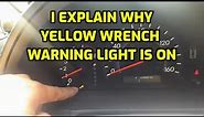 I EXPLAIN WHAT CAUSE THE YELLOW WRENCH WARNING LIGHT TO TURN ON