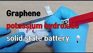 graphene and potassium hydroxide solid state battery