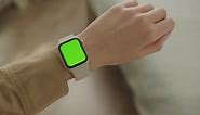 Green Screen Smartwatch on Woman Hand Looking at Chroma Key Watch