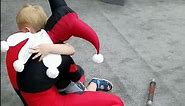Harley Quinn hugs little boy at Gen Con