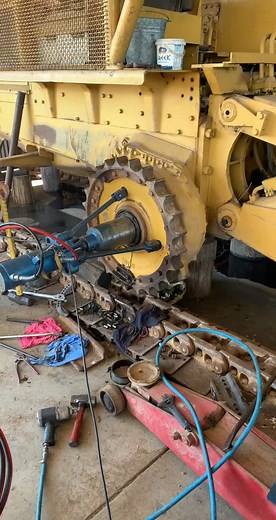 Earthmoving Mechanic Working on Caterpillar D7G Dozer