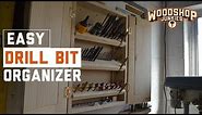 DIY drill bit storage and organizer cabinet with folding bit holder shelves.
