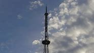 Telecommunication tower with sky in the background - Free Stock Video