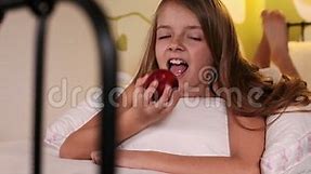 Smiling Happy Girl Eating an Apple in Bed Stock Footage - Video of cheerful, apple: 96311044