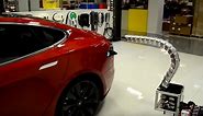 Tesla reveals robotic snake car charger
