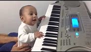 Baby playing keyboard