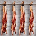 A Body Hanging Upside Down From a Meat Hook