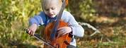 Baby Playing a Cello