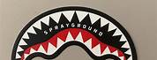 Sprayground Shark Teeth Logo