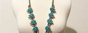 Turquoise Squash Blossom Necklace with White Blouse