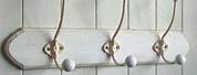 White Plinth with Victorian Coat Hooks