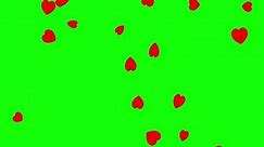 Falling red paper hearts on green screen background