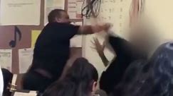 Teacher caught on camera punching student
