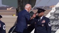 President Biden almost falls while walking up Air Force One stairs