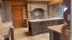 A look at the kitchen in Timber King Bryan Reid Sr’s 12,000 square foot dream house! Check out this kitchens unique features, from the Canadian Maple Leaf to the leaping salmon! #pioneerloghomes #loghome #luxuryhomes #britishcolumbia