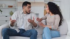 Angry family quarrel conflict misunderstanding multiracial married couple upset mad boyfriend and disappointed girlfriend husband and wife woman and man argue yelling divorce shout offended separation