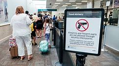 TSA confiscates record number of guns in 2021