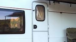 Road trip on camp van. Happy woman on travel trip on rv car. Female traveler coming out from camper van and enjoy nature view. Motorhome travel trip. Concept of vacation