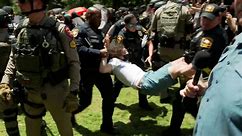 Watch moment police tear down protesters' barrier at University of Texas at Austin