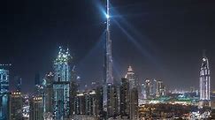 Dubai downtown cityscape with building in Dubai LightUp light show aerial timelapse from rooftop. With the largest light and sound show on a single building The United Arab Emirates city of Dubai has
