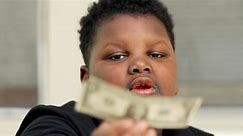 Boy rewarded after giving away his only dollar