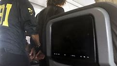 Plane passengers duct-tape unruly man