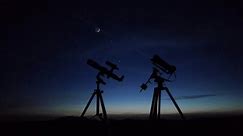 Astronomical telescope and camera on a startracker tripod for observing and capturing stars, planets, Moon and other cosmic celestial objects.