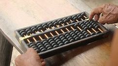chinese abacus is a calculating tool used primarily in parts of Asia for performing arithmetic processes.