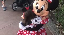 Adorable toddler gives Minnie Mouse epic hug
