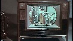 1960s - The wonders of the newly invented remote control are displayed along with wonderfully corny shots of a model displaying a retro television set.