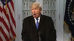 Alec Baldwin returns to skewer Trump on SNL – video