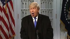 Alec Baldwin returns to skewer Trump on SNL – video