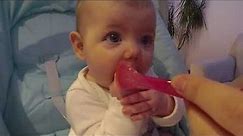 Baby eating solid food for the first time