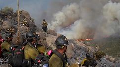 Helmet-cam videos reveal the 19 Hotshot firefighters who were killed while responding to the Yarnell wildfire last summer made several desperate radio calls for help