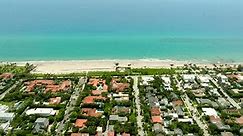 Aerial video South Ocean Blvd Palm Beach luxury coastal mansion homes