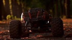 Back view rc car stars-off the ride. Monster allterrain truck in autumn forest.