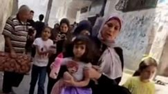 Terrified women and children flee Israeli explosions