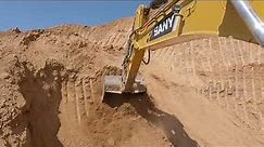 SANY Excavator loading soil on trucks