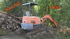 Hitachi 35u mini excavator leveling yard.