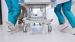 People, doctor and legs running with bed for emergency, ICU or quick surgery to save a life at hospital. Closeup of medical group or shoes in rush with stretcher for healthcare, urgency or support