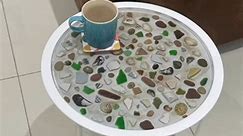 Hand made beach finds side table for sale. I had so much fun making this! Beautiful sea glass, sea pottery, pebbles shells and sand all found around the north coast. Set in food safe and heat resistant expoy resin. Must be collected in Coleraine. The photos don’t do this piece justice. PM if interested! £50 (selling at way less than cost price as moving house and don’t have room to store it!) | Pebblescape