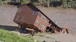 Watch moment house collapses into flood water