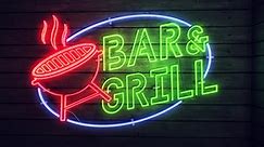 Premium stock video - Realistic render of a vivid and vibrant flashing and flickering animated neon sign, with the words bar - grill, on a wood panelled wall background