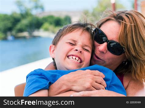 Older Mom Teasing Son With Kisses Free Stock Images And Photos