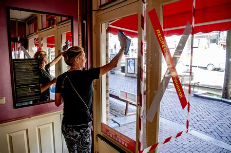 kissing banned as amsterdam s famous red light district reopens after