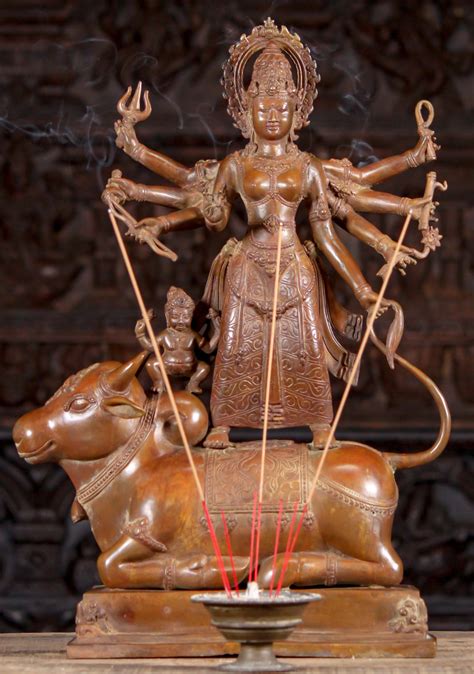 brass statue  hindu goddess durga   arms standing  buffalo