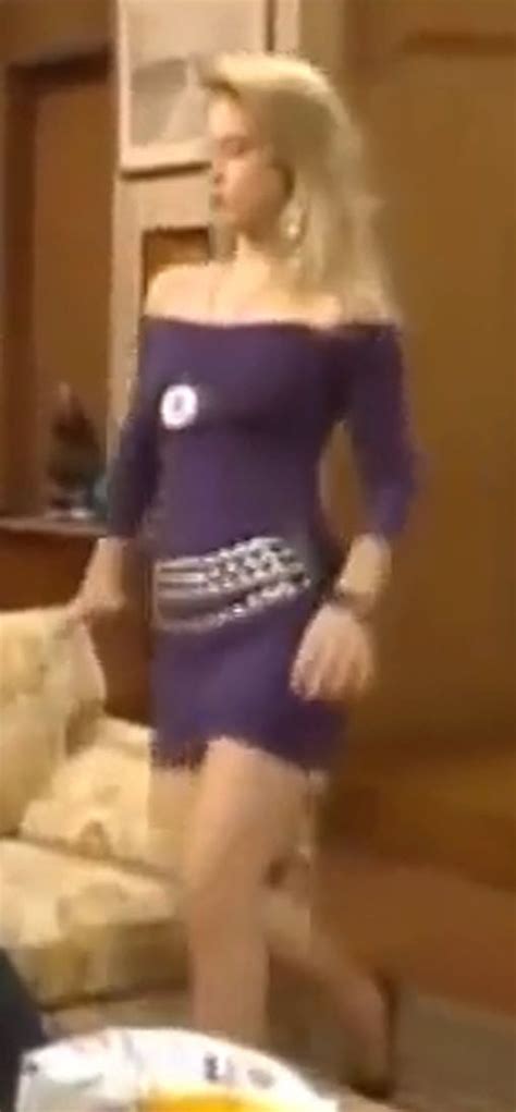 kelly bundy in purple off shoulder tight dress with