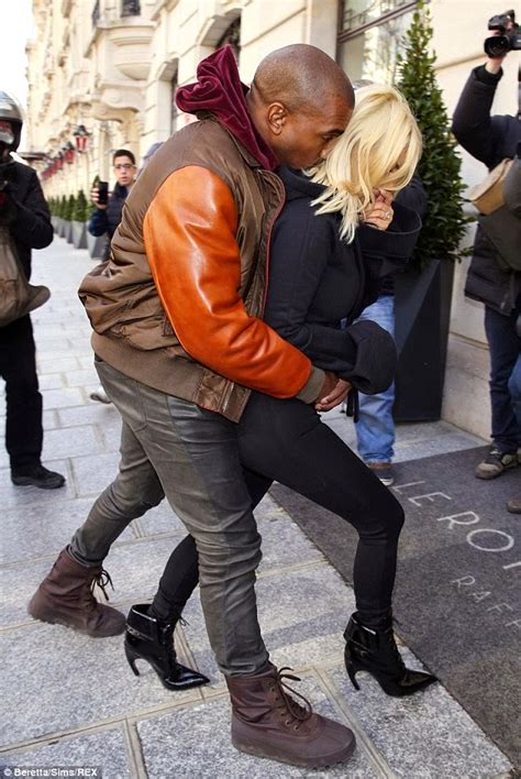 photos kanye grabs kim s butt as the two return to their