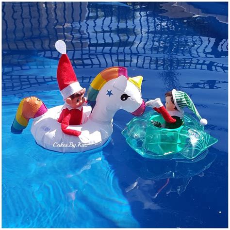 elf on the shelf having fun in the pool in their new floats