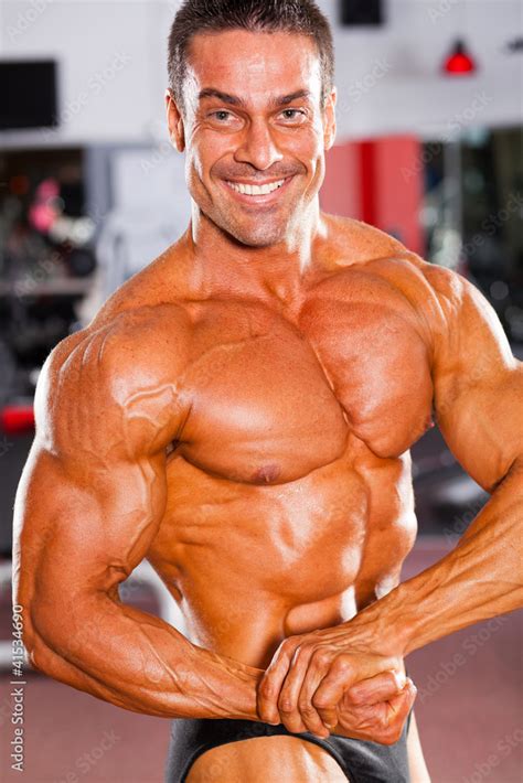 professional male bodybuilder posing  gym stock photo adobe stock